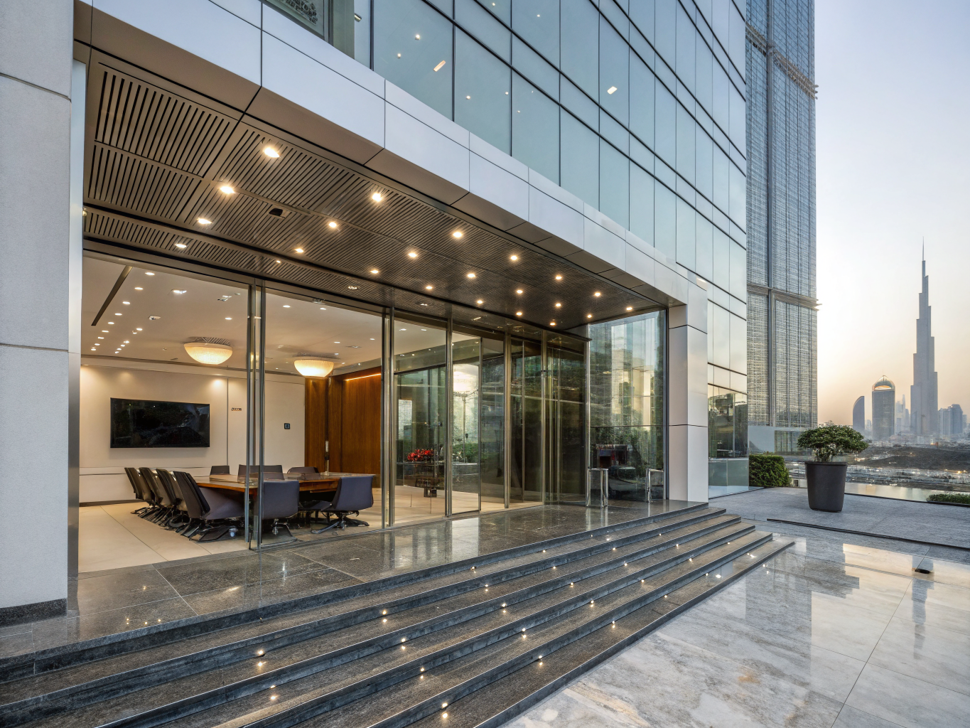 High-end corporate boardroom overlooking the Dubai financial district skyline